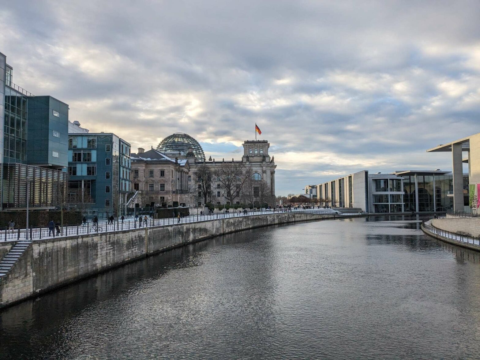 Walking across a bridge with views of the Reichstag building in Berlin